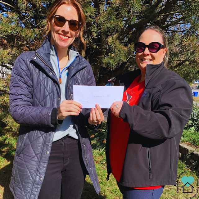 President Chelsea Watterworth presents Emily O'Conner, staff of Niagara College with the bursary funds. February 2024