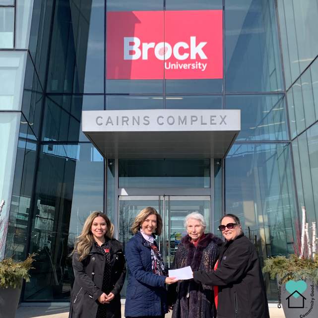 President Chelsea Watterworth and Vice-President Helen Atteck present Brock University with the student bursary funds. February 2024